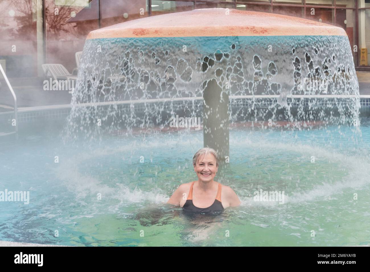 Decorative mushroom with shower in the water park Stock Photo - Alamy