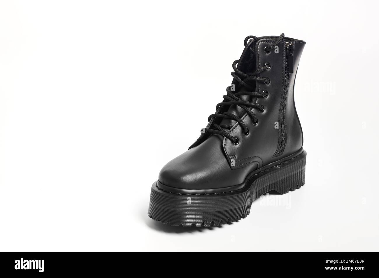 One black women combat boot on high heel platform with lug sole on ...