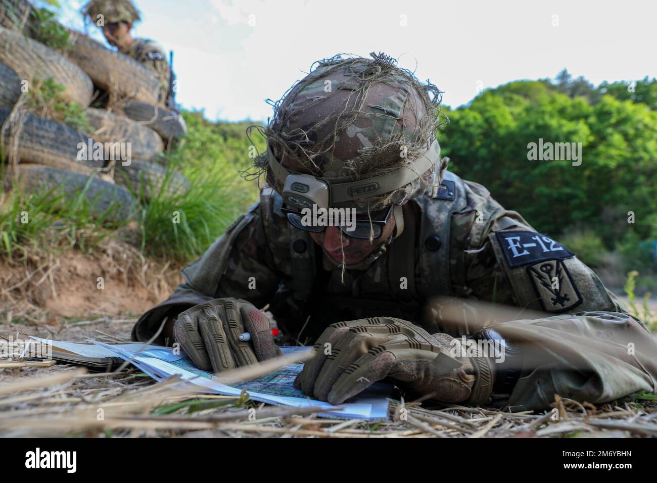 U.S. Army Spc. Michael Dull, 501st Military Intelligence Brigade, plots ...