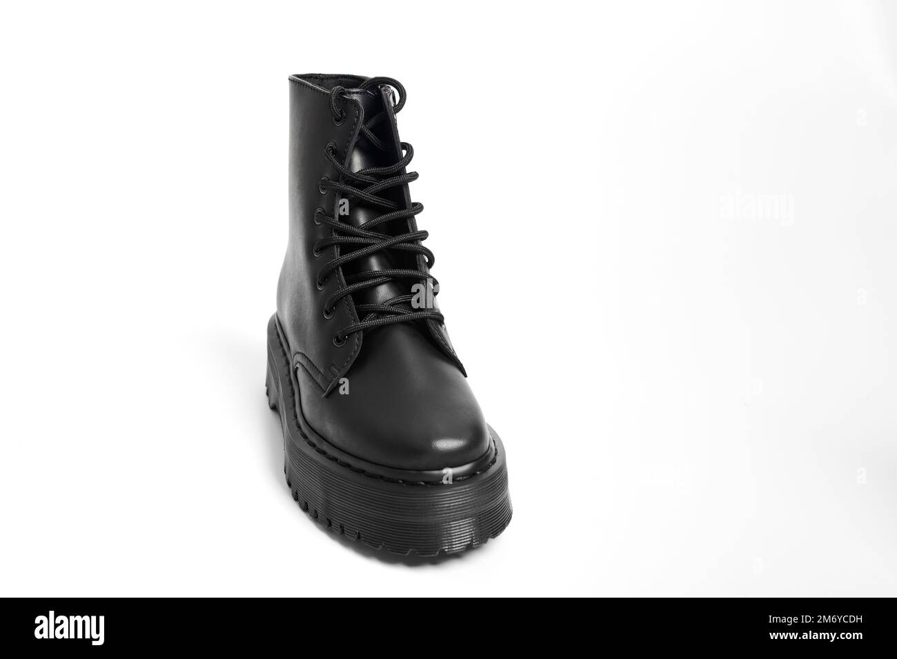 One black women combat boot on high heel platform with lug sole on ...