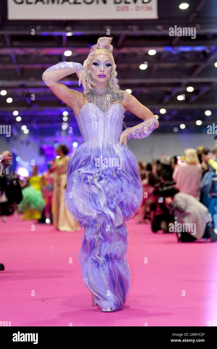 Drag queens take part in a catwalk show during the official opening of