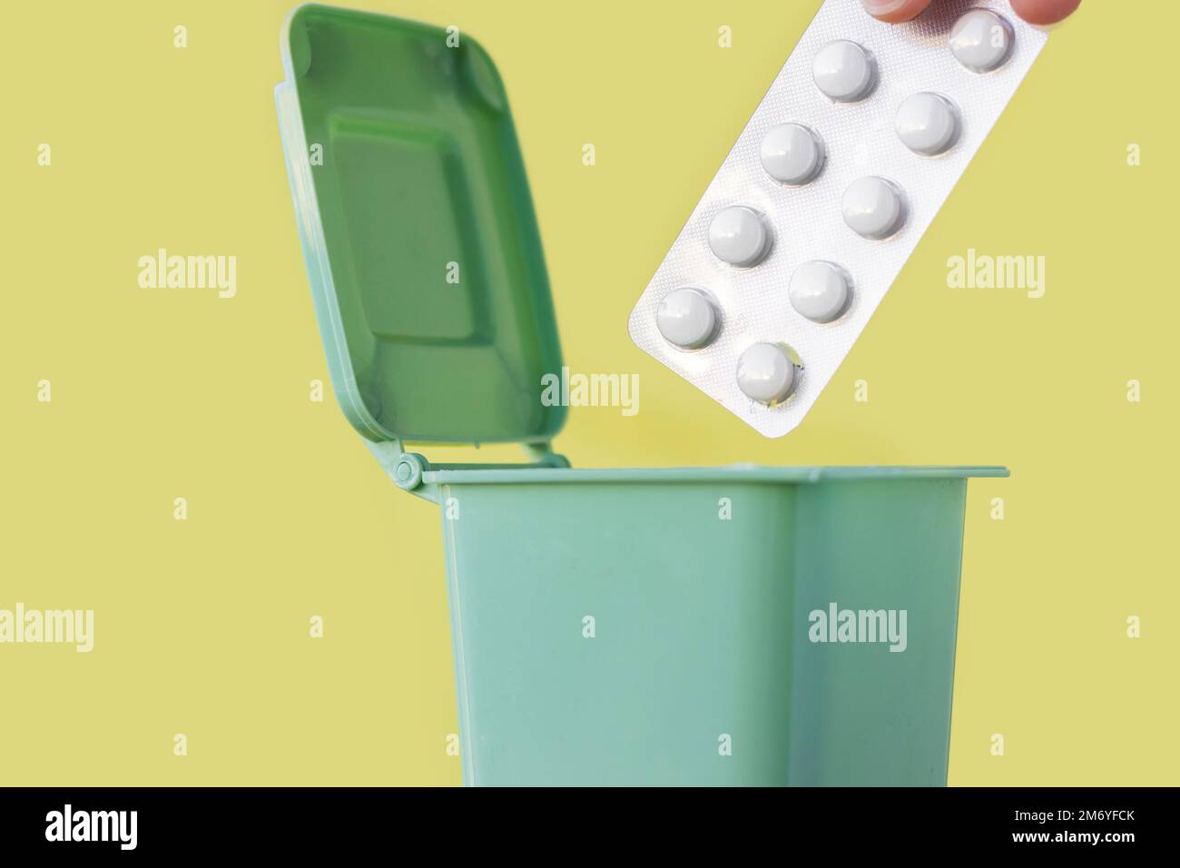 https://c8.alamy.com/comp/2M6YFCK/plastic-blister-thrown-in-mini-small-trash-garbage-bin-canexpired-pills-blister-with-removed-missing-tablets-isolatedunused-or-expired-medicine-drop-2M6YFCK.jpg