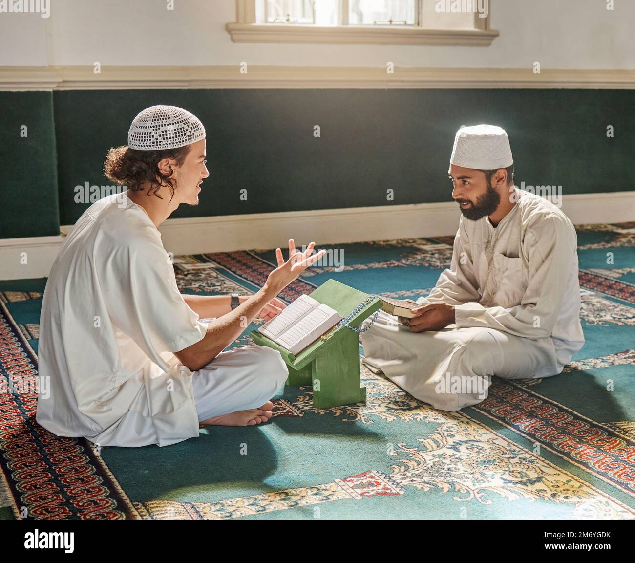 Muslim pray, worship or men studying the Quran for peace, mindfulness or support from Allah in holy mosque. Learning, Islamic or people talking Stock Photo