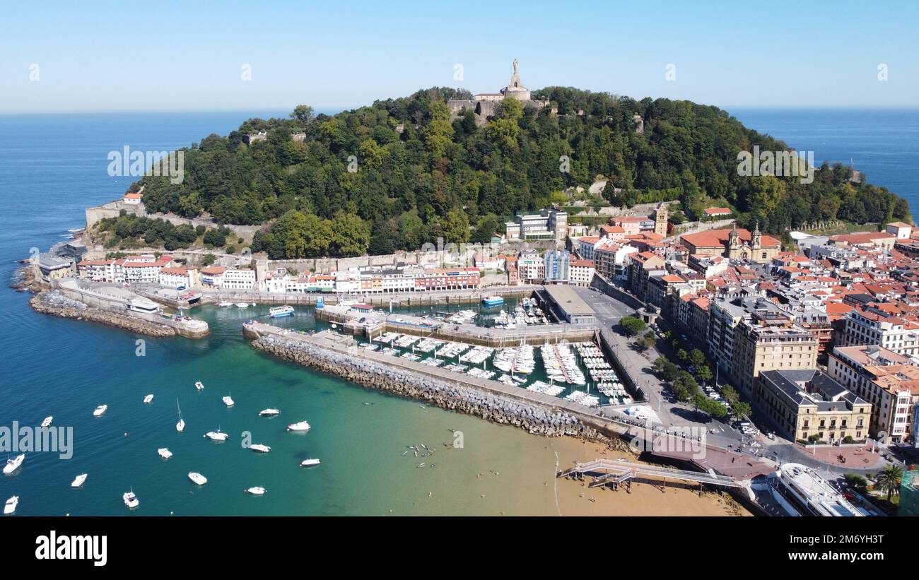 San Sebastian Bay in Spain & Biarritz France aerial footage taken from a drone, perfect summer weather clear blue skies with warm sea water, Stock Photo