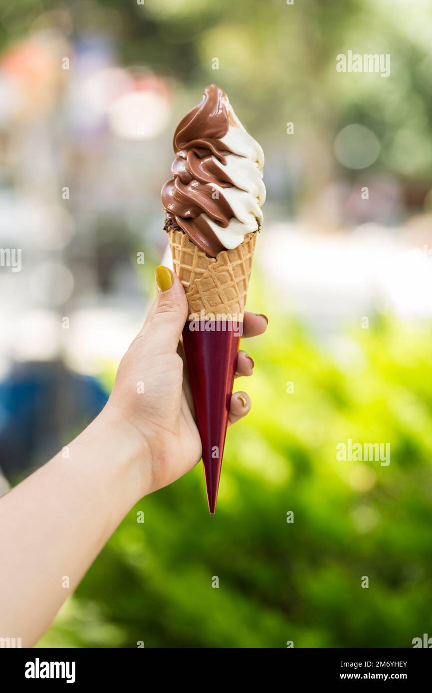 girl holding ice cream cone Stock Photo Alamy
