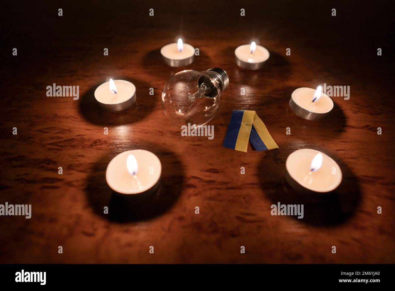 Electric light bulb with a yellowblue ribbon (national symbol of