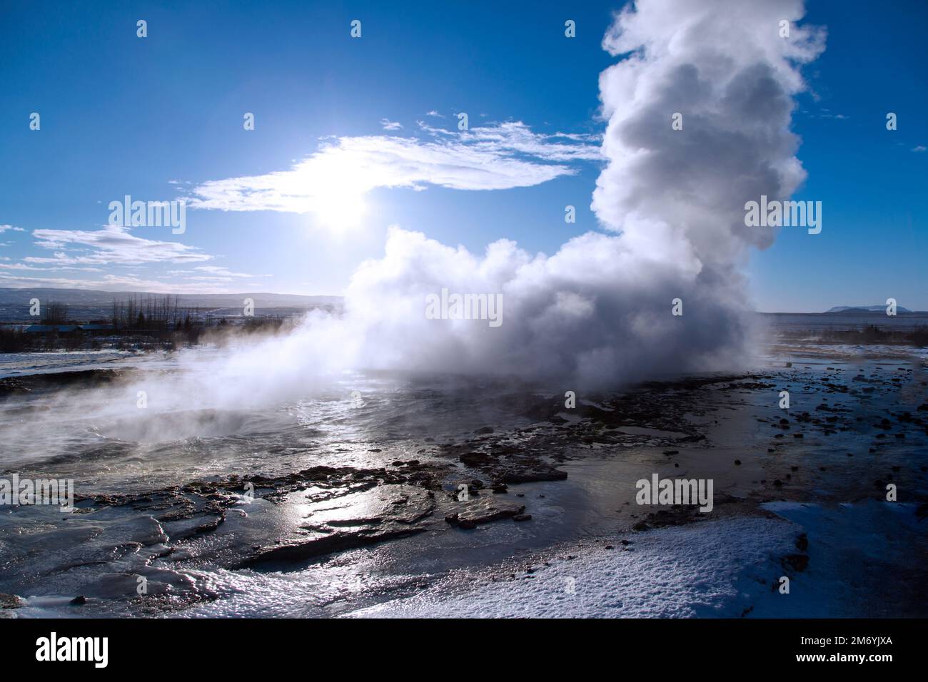 A closeup shot of a hot geysir spring coming out of the earth on a cold winter day Stock Photo