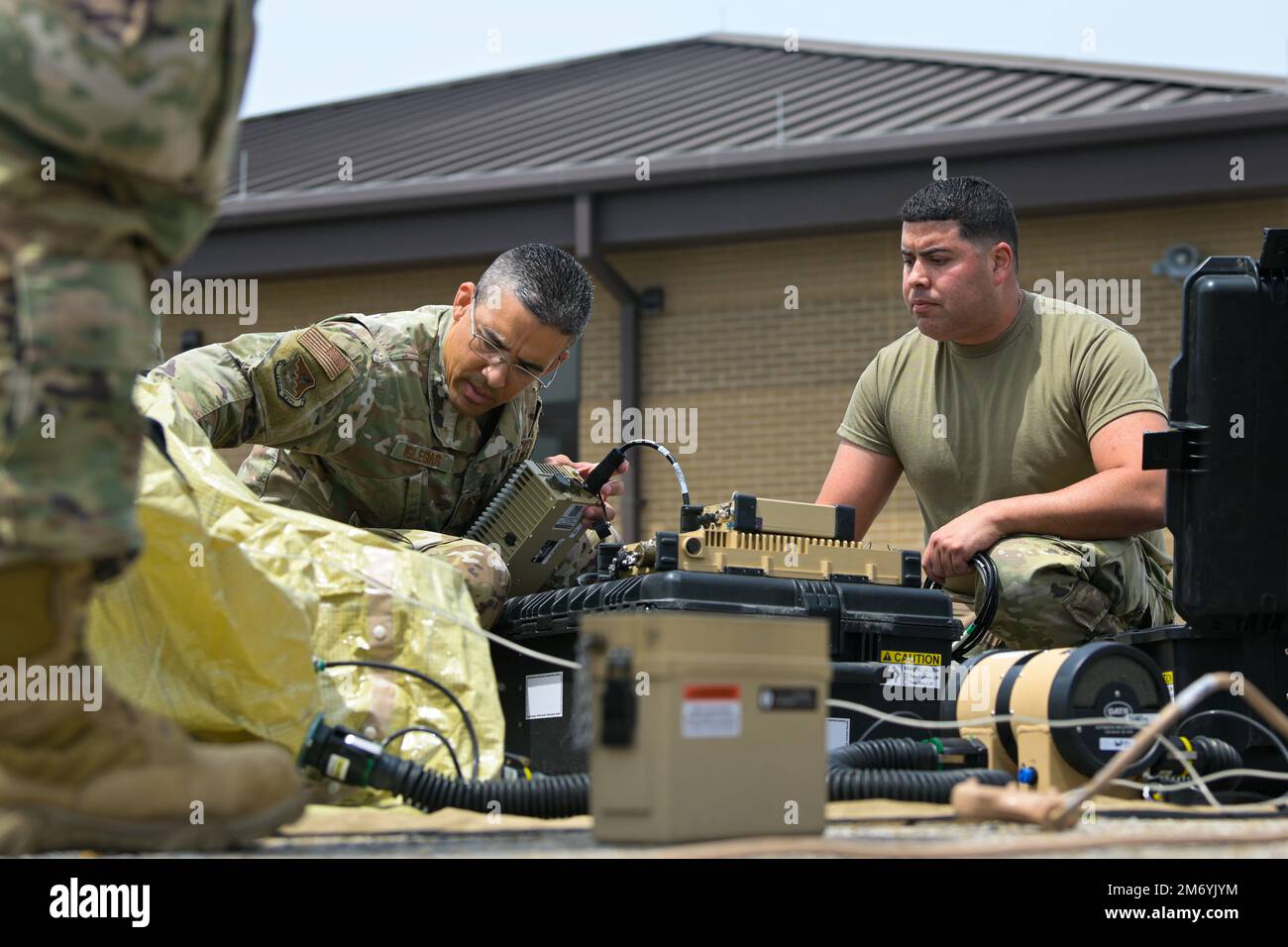 U.S. Air Force Senior Master Sgt. Raul Iglesias, left, the cyber systems support superintendent, and Master Sgt. Radames Mercado, a radio frequency transmission journeyman, both with the 156th Contingency Response Group, prepare the inflatable ground antenna to transmit and receive ball (GATR) which will be used to establish phone, data, and voice services on non-classified internet protocol router network (NIPRNet) and secret internet protocol router network (SIPRNet) during Southern Strike at Gulfport Combat Readiness Training Center, Gulfport, Mississippi, April 20, 2022. Southern Strike 20 Stock Photo