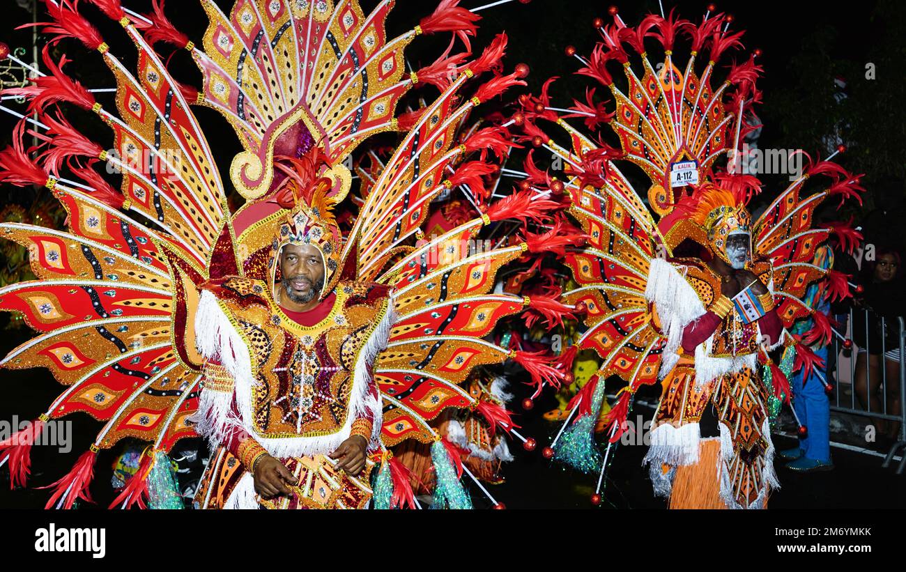 The men in a traditional costume during a Junkanoo parade in the Bahamas. Stock Photo