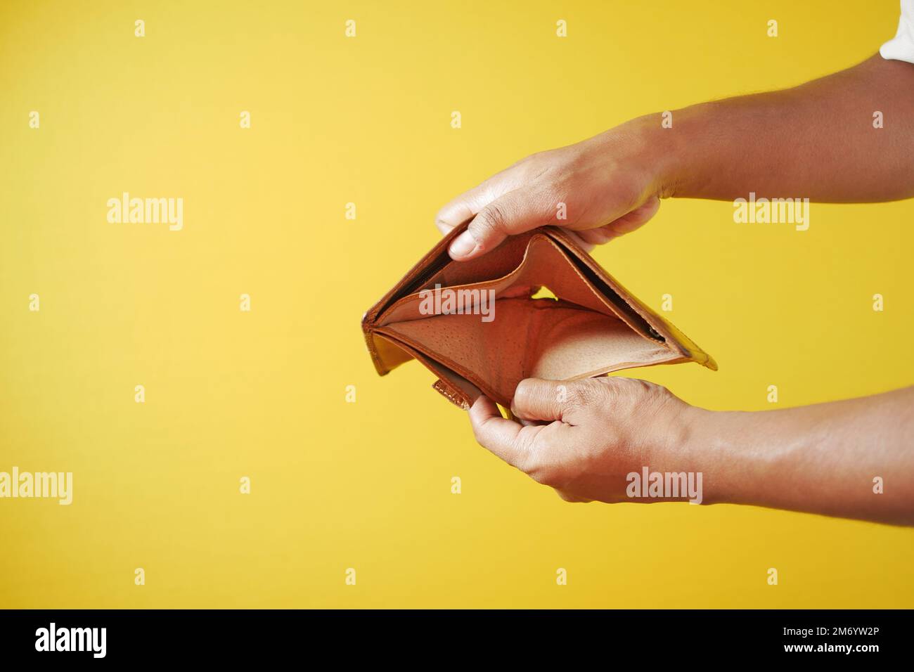 Man hand open an empty wallet with copy space. Stock Photo