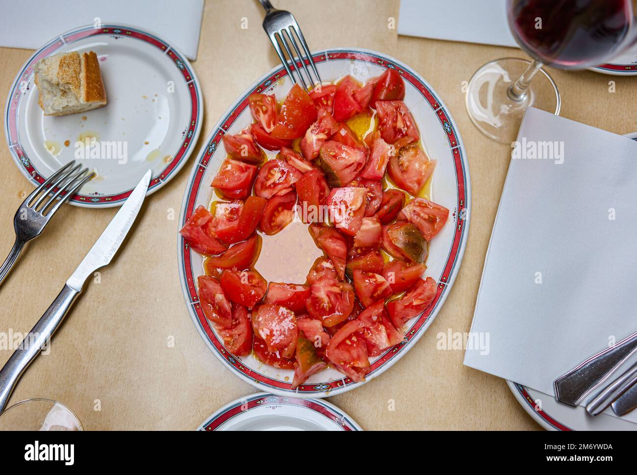Typical Basque tomato salad, dressed with olive oil. Stock Photo