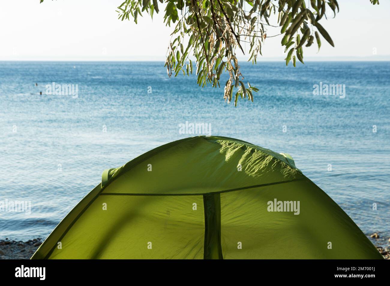 tent camp set up by the sea Stock Photo