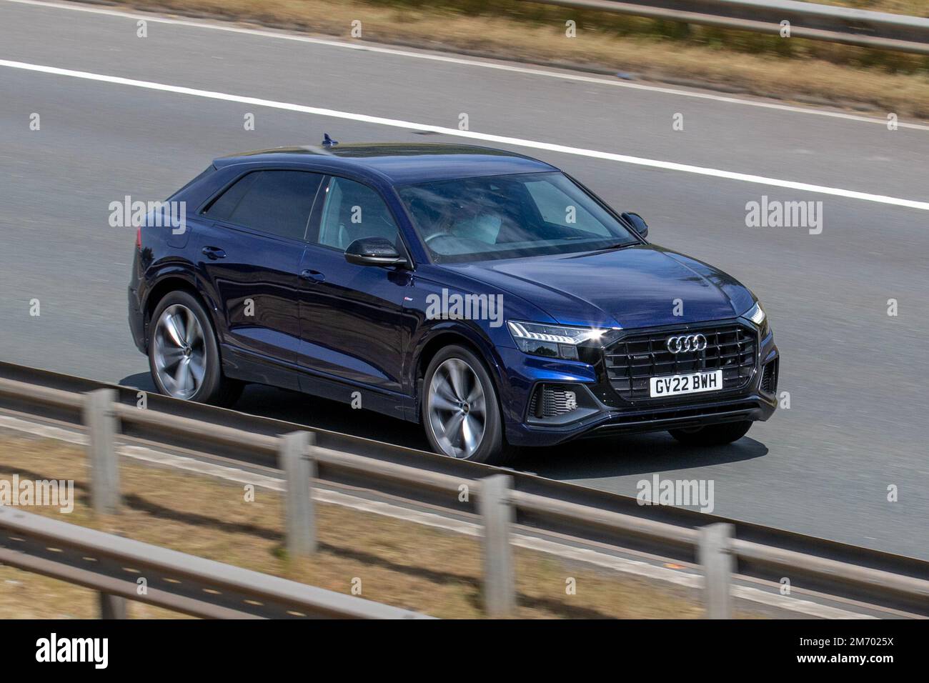 2022 Blue Audi Q8 SLN BLK ED 55Tfsi Mhev Petrol 8 speed automatic;, 3.0-litre twin-turbo V6 travelling on the M6 Motorway, Manchester, UK Stock Photo