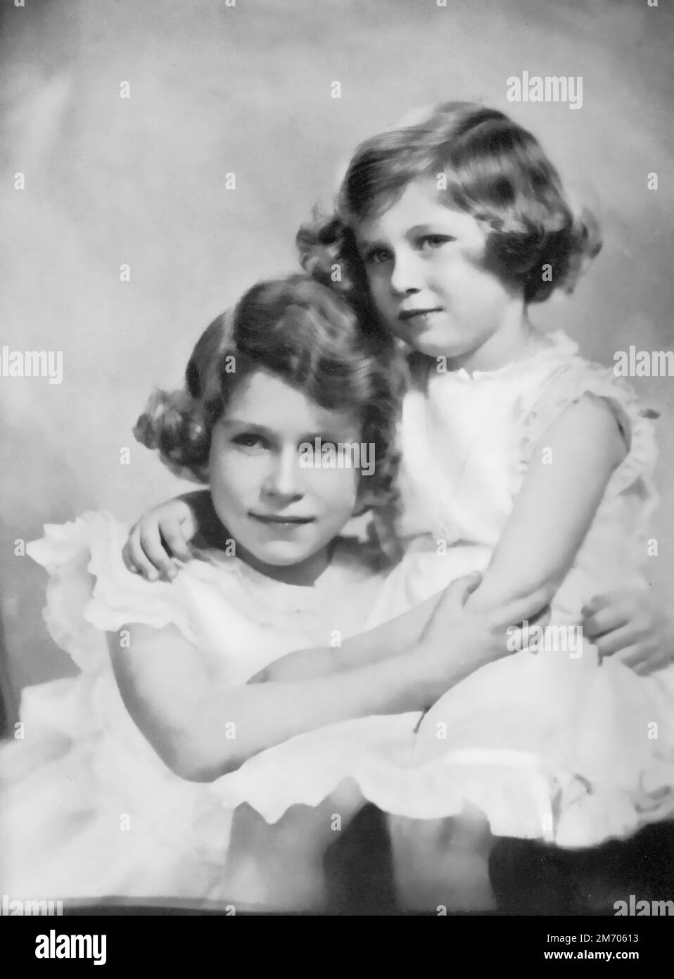 Princesses Elizabeth and Margaret, c1937. Princess Elizabeth, later Queen Elizabeth II (1926-2022) and Princess Margaret, later Princess Margaret, Countess of Snowdon (1930-2002), photographed aged approximately 11 and 7 years old. Stock Photo