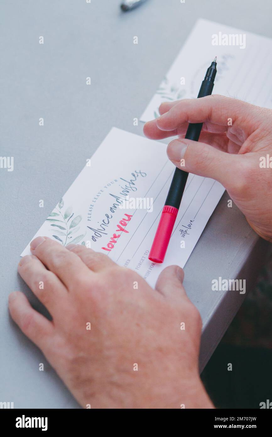 Wedding Guest Writes Message to Bride and Groom Stock Photo Alamy
