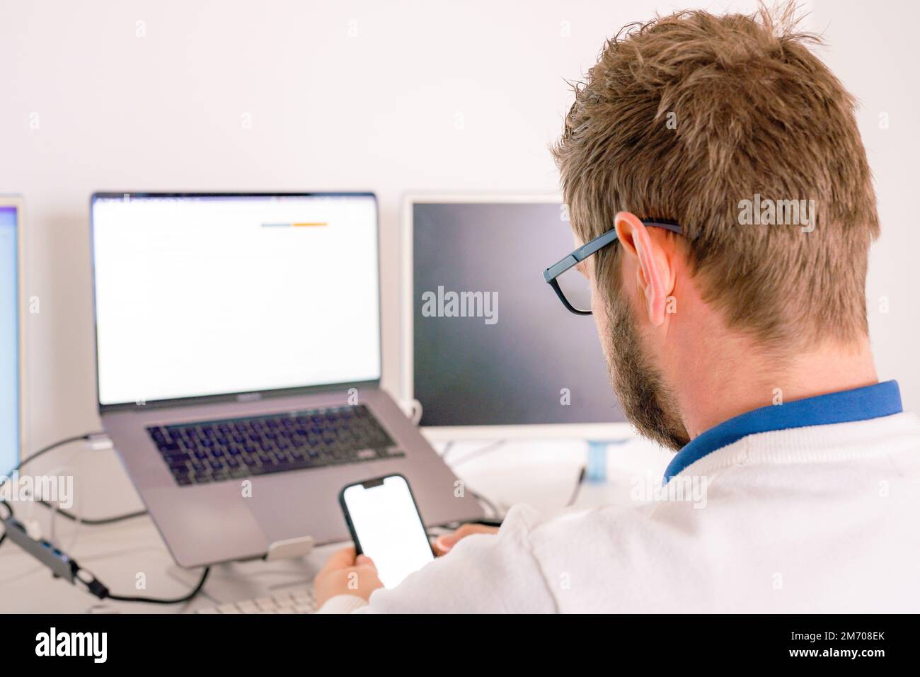 Computer programmer writing program code on computer in office Stock Photo
