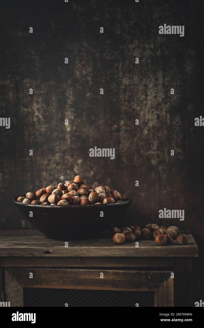 Hazelnuts in a bowl with copy space Stock Photo