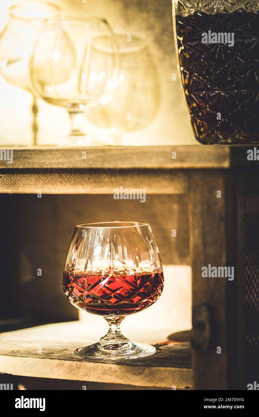 A drink of brandy in a crystal tumbler Stock Photo