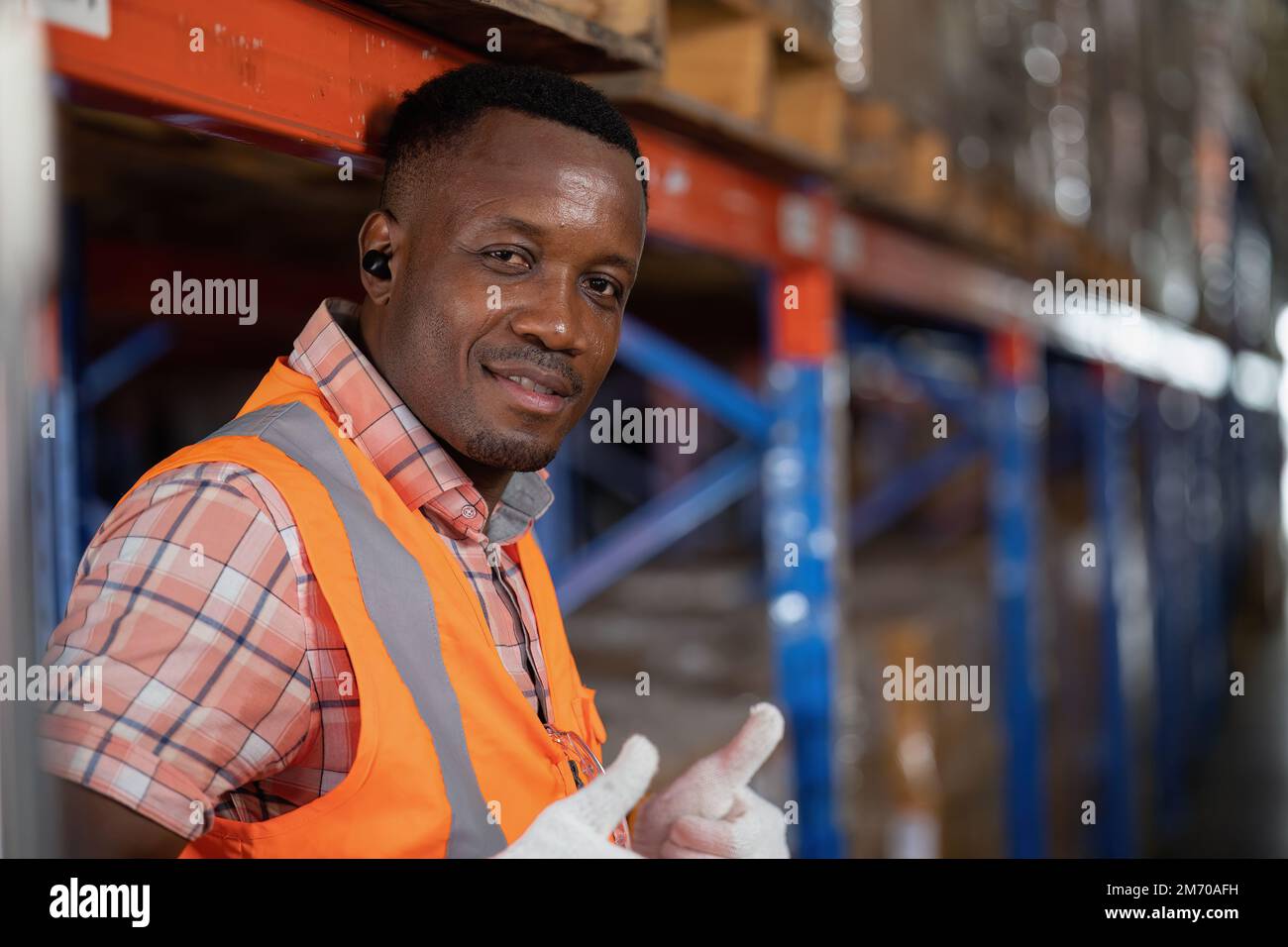 Worker in depot storage warehouse check scan barcode goods box and ...