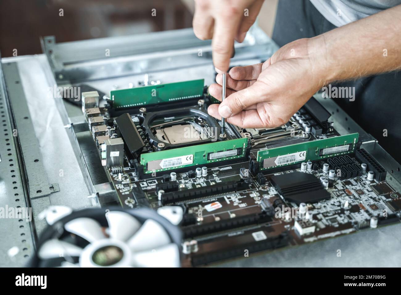 Man engineer,collector.Independent self computer assembly. Mounting socket  processor,random access memory RAM,motherboard,fan. Home crypto mining farm  Stock Photo - Alamy
