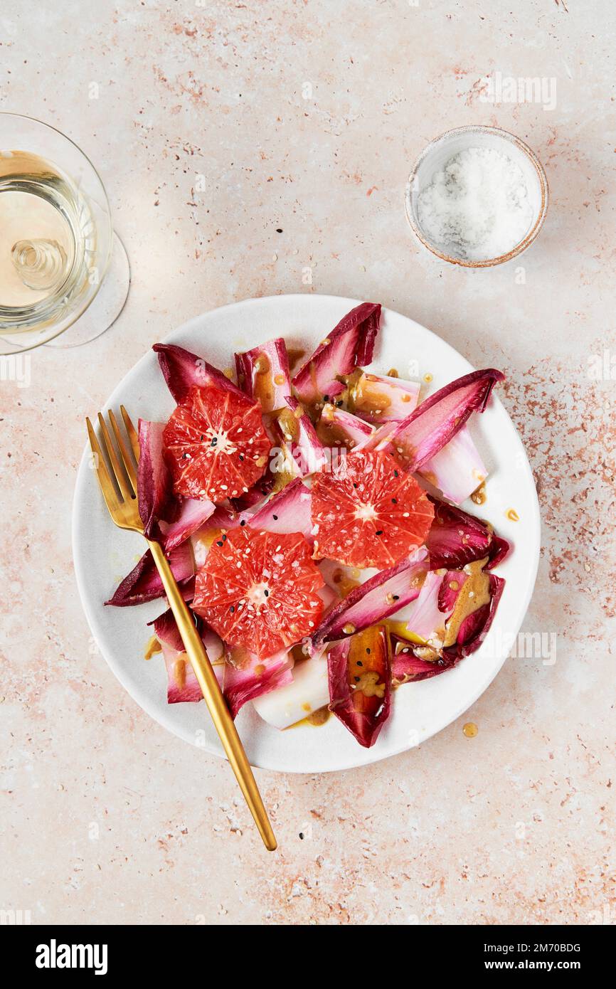 Endive and Grapefruit Salad with Mustard Dressing and White Wine Stock Photo