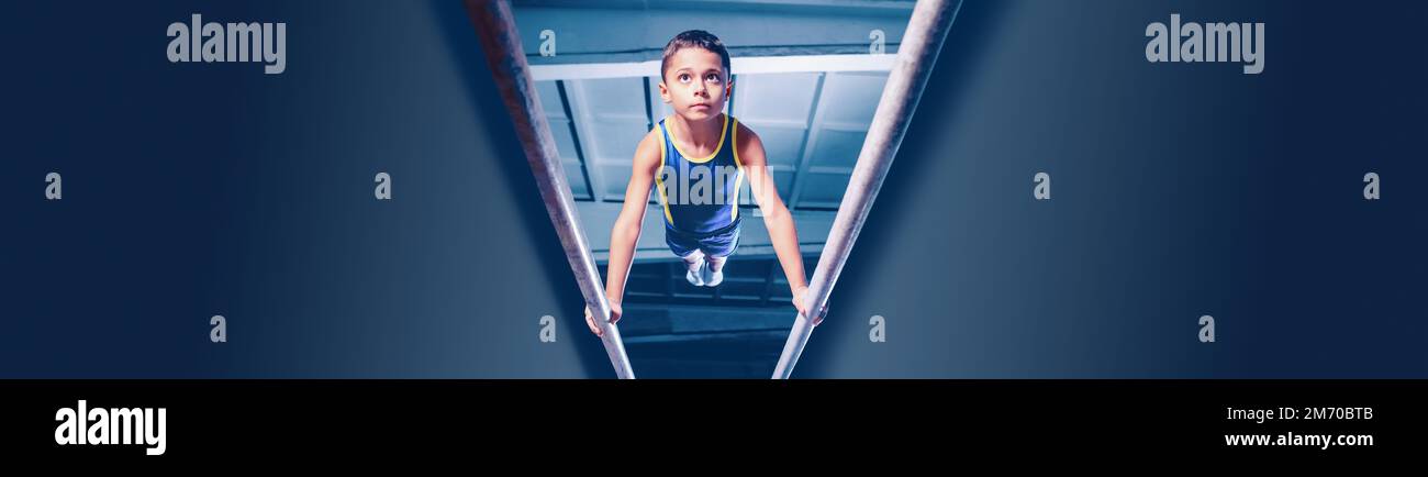 Image of little boy, child training, doing gymnastics exercises on ...