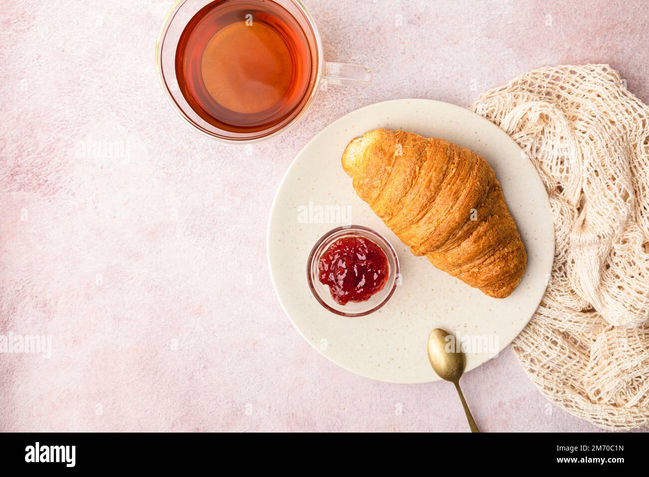 Tea and croissant over table Stock Photo