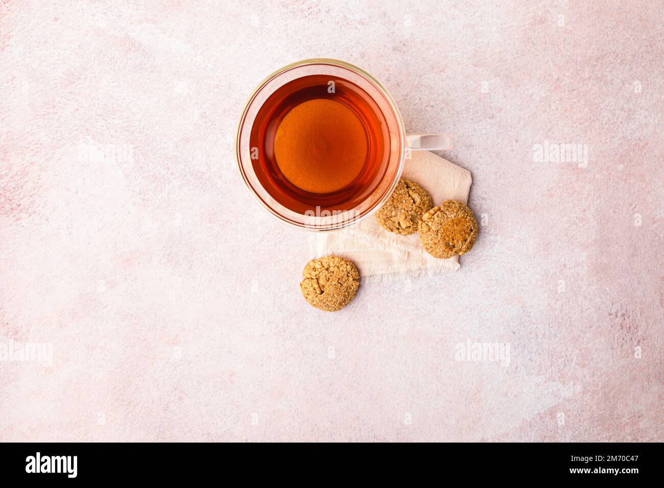 Cup of black tea with homemade oats and walnut cookies. Stock Photo