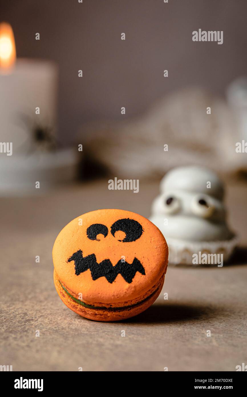 Jack o lantern macaron over table for Halloween Stock Photo