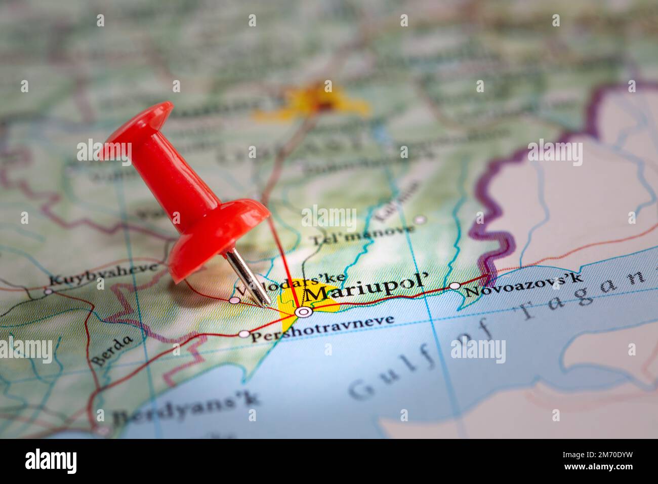 A red push pin marking the location of the Ukrainian port city of Mariupol in the Donetsk region of Ukraine and a target of Russian invasion during th Stock Photo