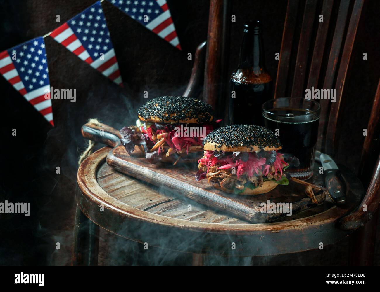 pulled pork burger with black sesame with Crunchy Apple Slaw, Pickled Red Cabbage, Crunchy Apple Slaw, American Flag, USA Independence Day Stock Photo