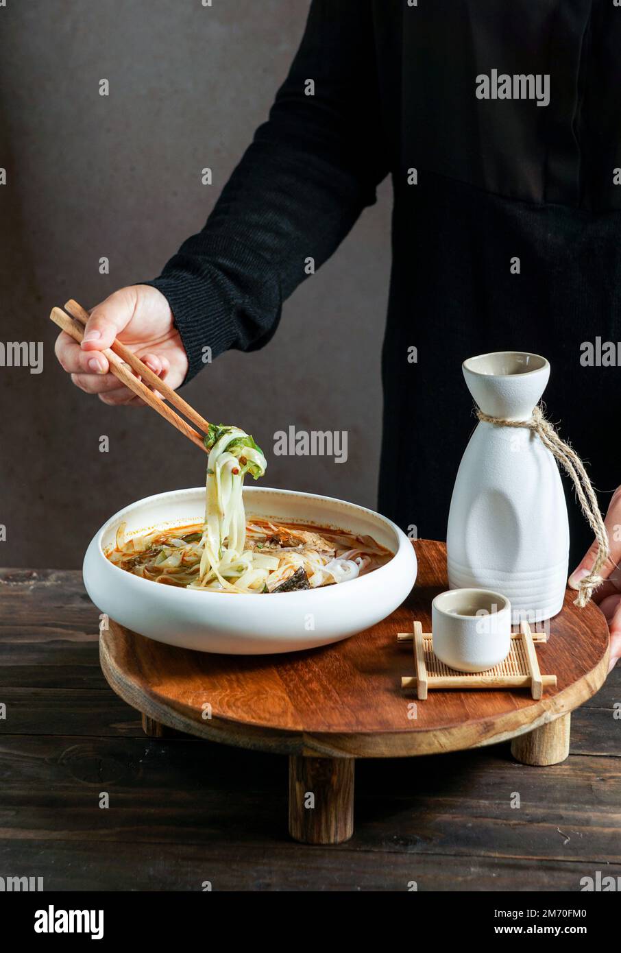 Japanese sake composition with Asian soup with rice noodles, Asian meal