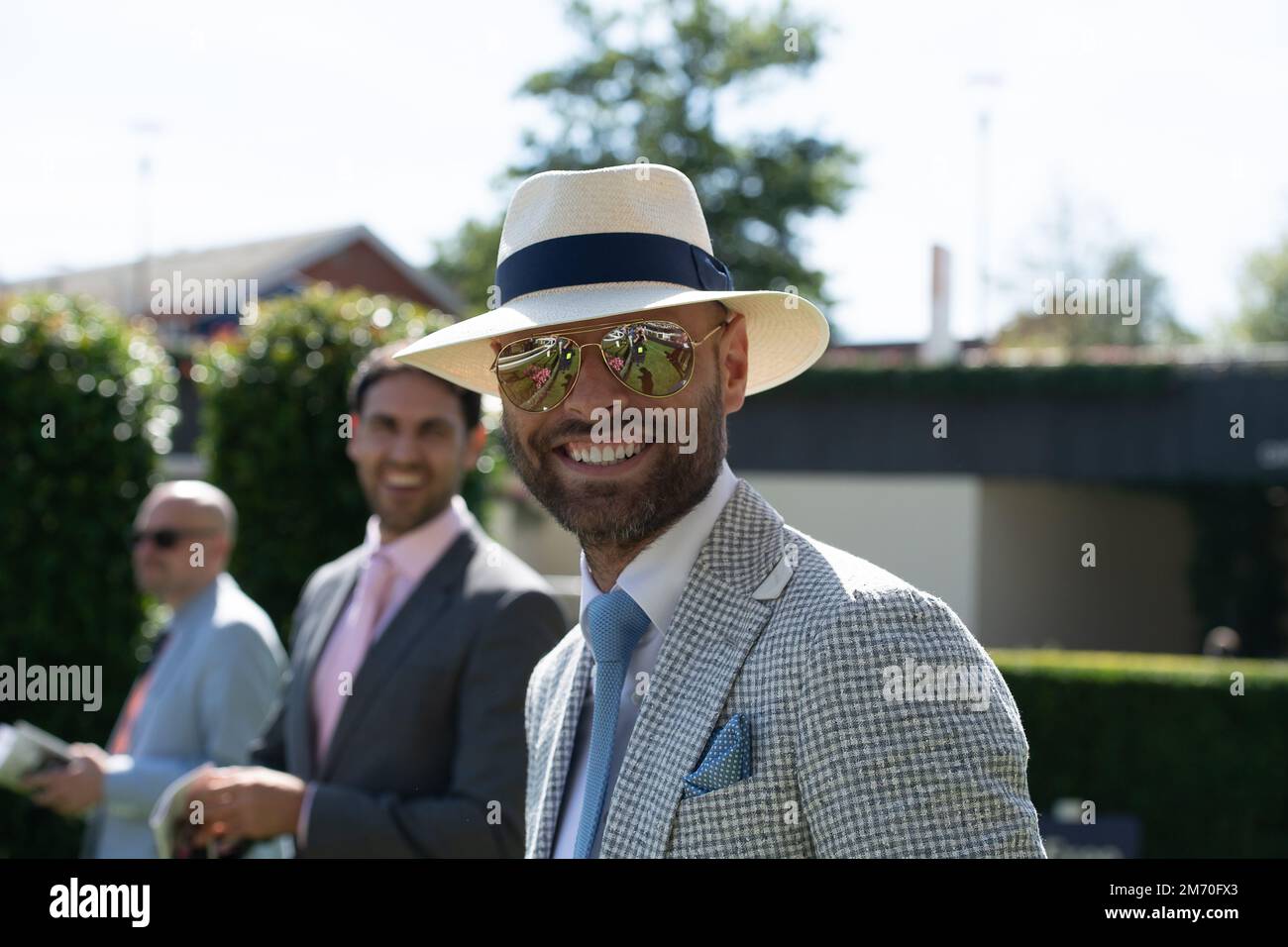 Ascot, Berkshire, UK. 6th August, 2022. A man looks fashionable in his ...