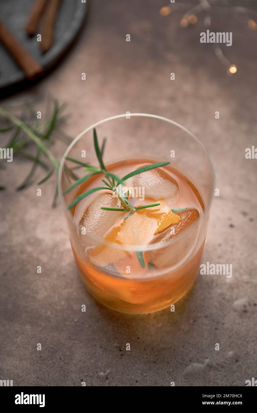 Old Fashioned Cocktail in a tumbler with bitters, whiskey and sugar Stock Photo