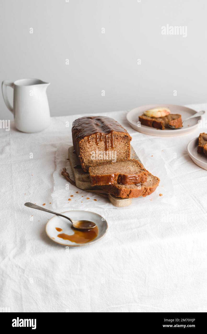 Breakfast apple cake with salted caramel in a table Stock Photo