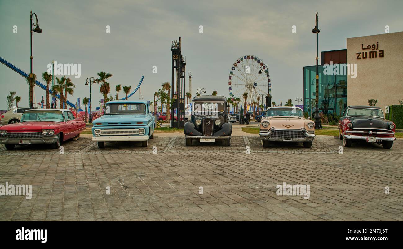 Classic cars on display in Lusail Winter Wonderland outdoor amusement