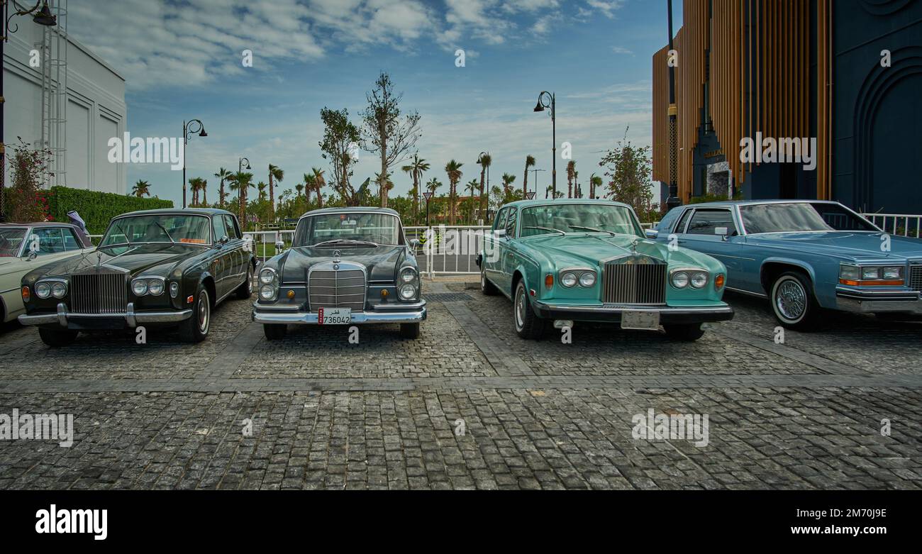 classic cars on display in Lusail Winter Wonderland outdoor amusement