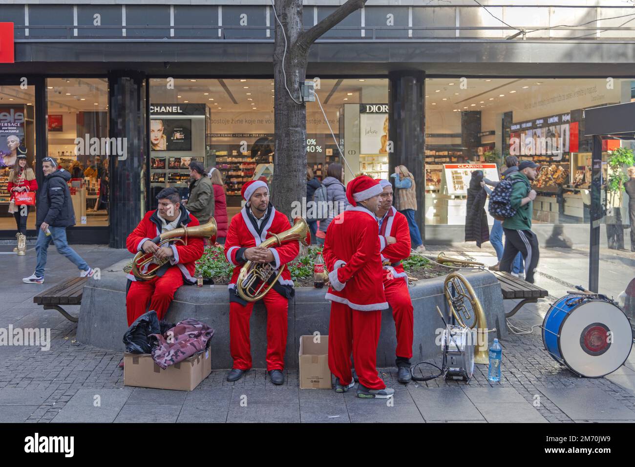 Belgrade, Serbia - December 31, 2022: Street Performers Musicians Dressed as Santa Claus During Christmas Festivity in Capital City Centre. Stock Photo