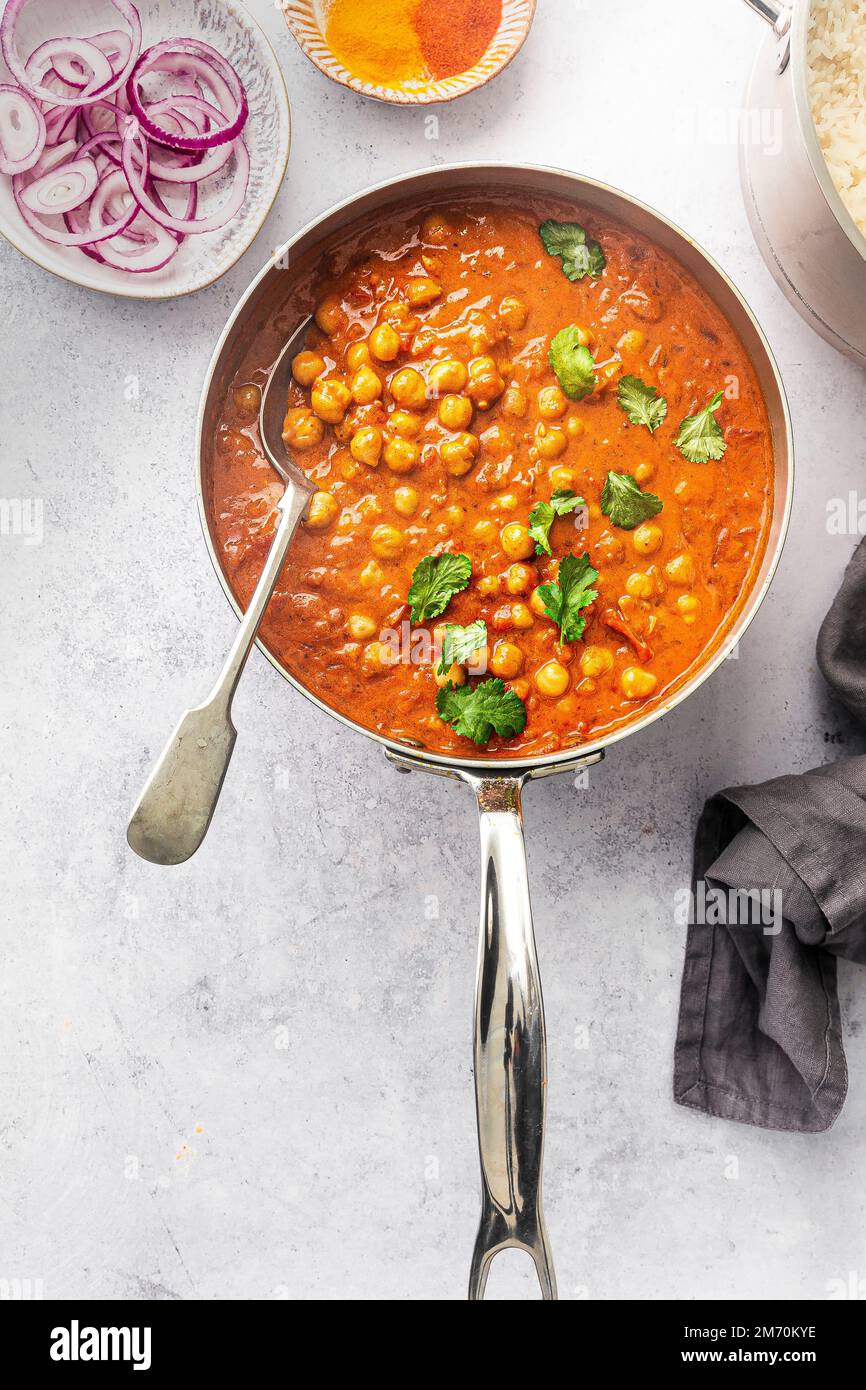 Chickpeas curry in a saucepan Stock Photo
