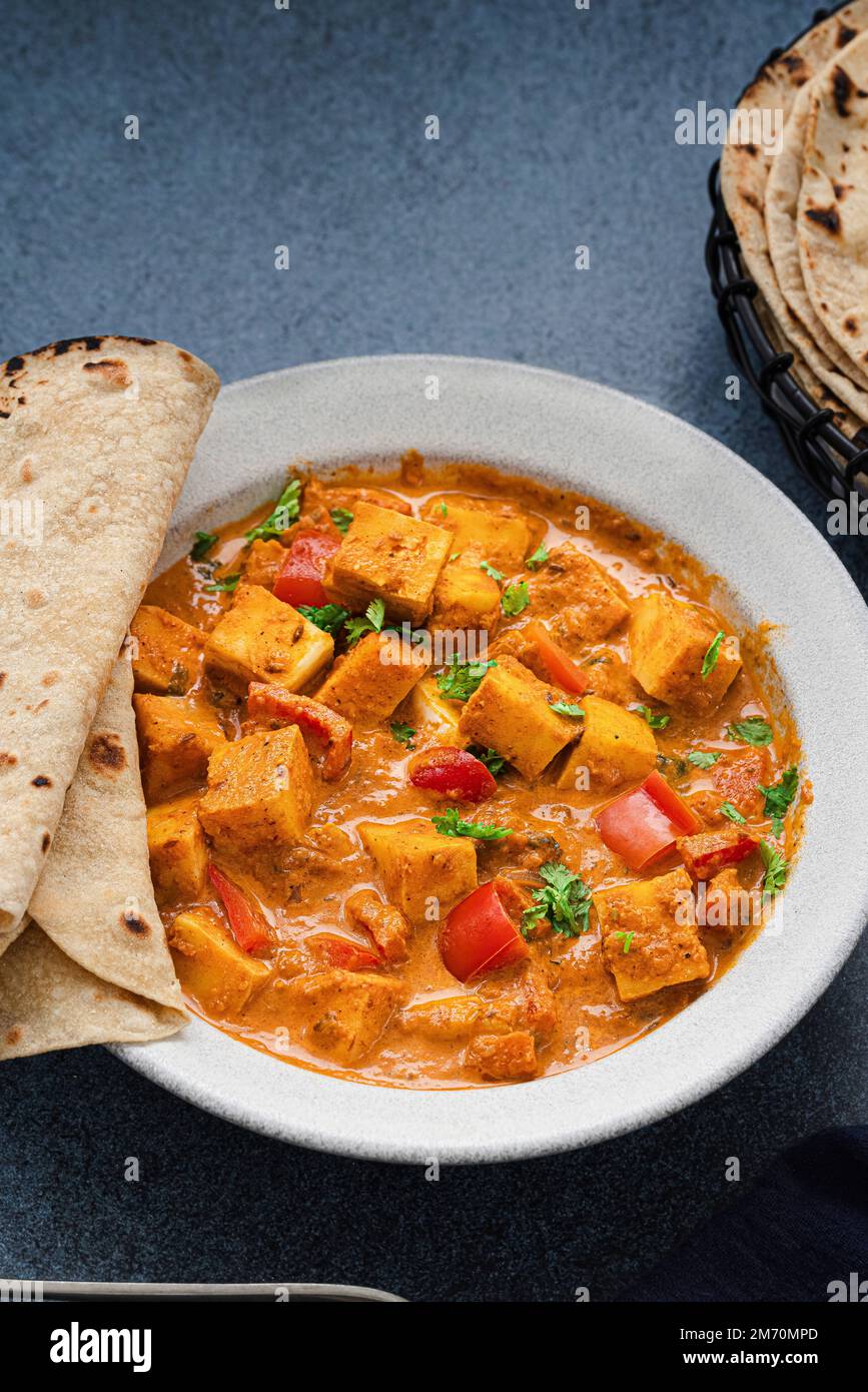Paneer curry served with roti Stock Photo - Alamy