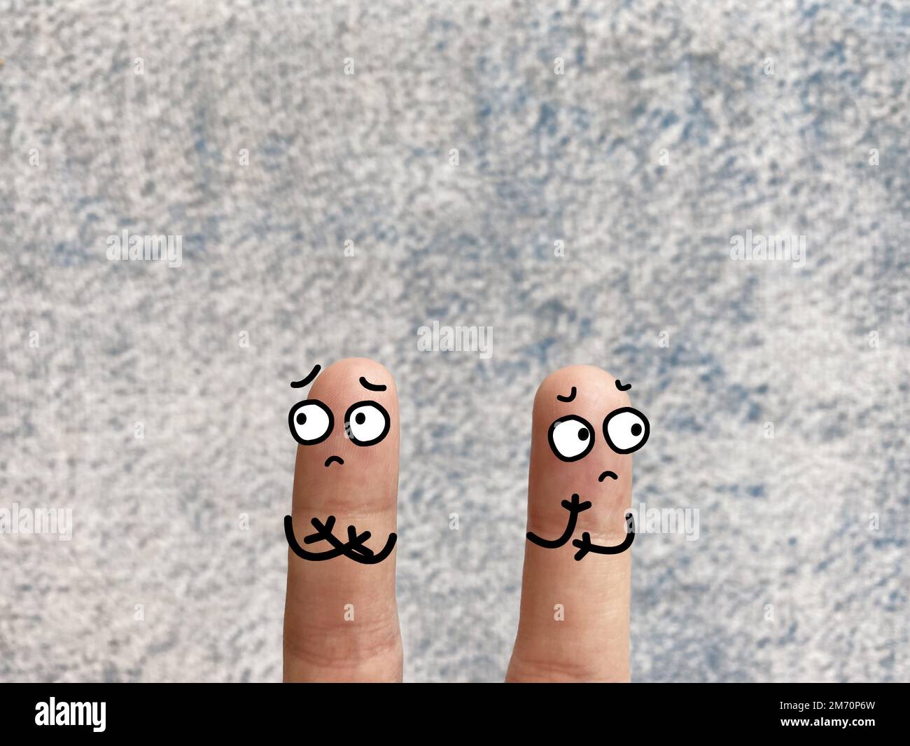 Two fingers are decorated as two person. They are angry at each other ...