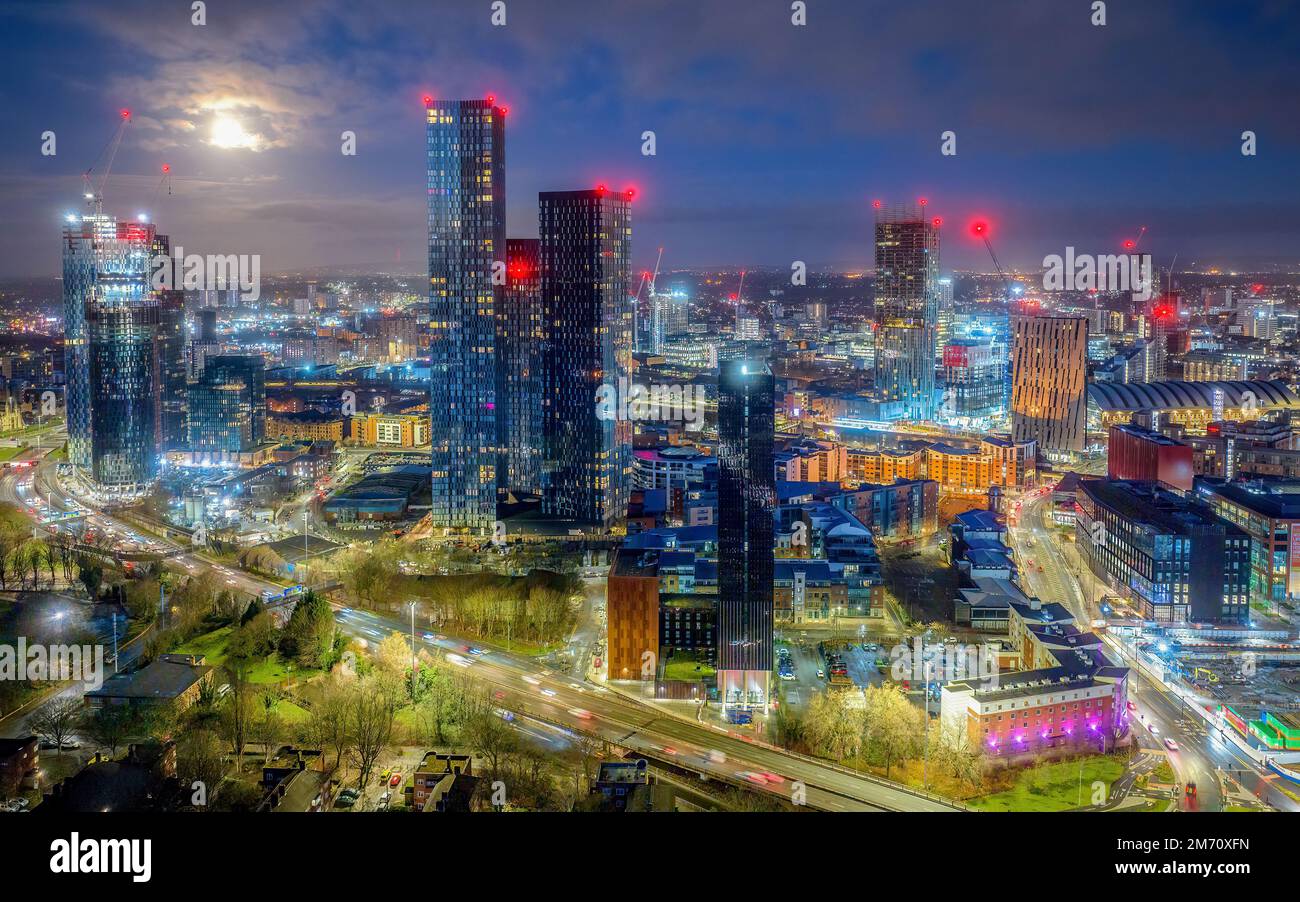 Manchester City centre Aerial night view of Deansgate Square Manchester England, construction building work at dawn with city lights and dark skies Stock Photo