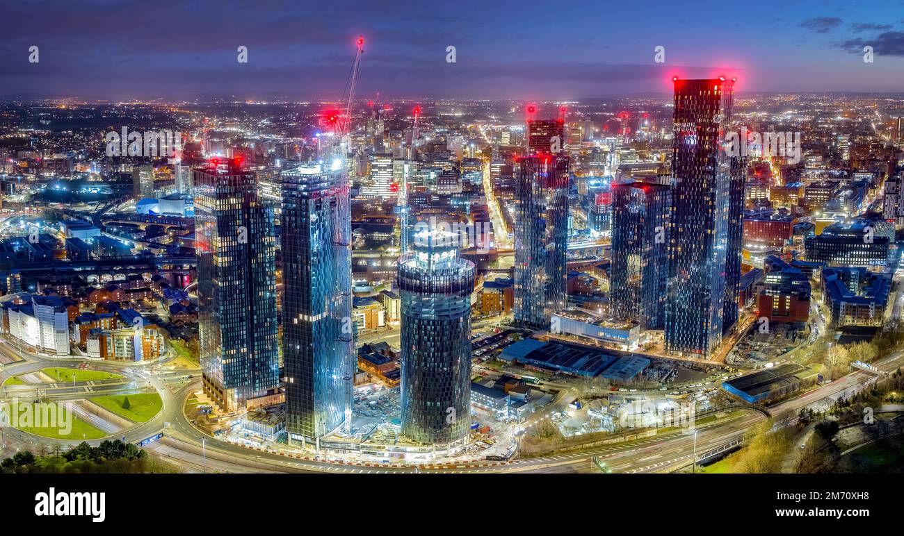 Manchester City centre Aerial night view of Deansgate Square Manchester England, construction building work at dawn with city lights and dark skies Stock Photo