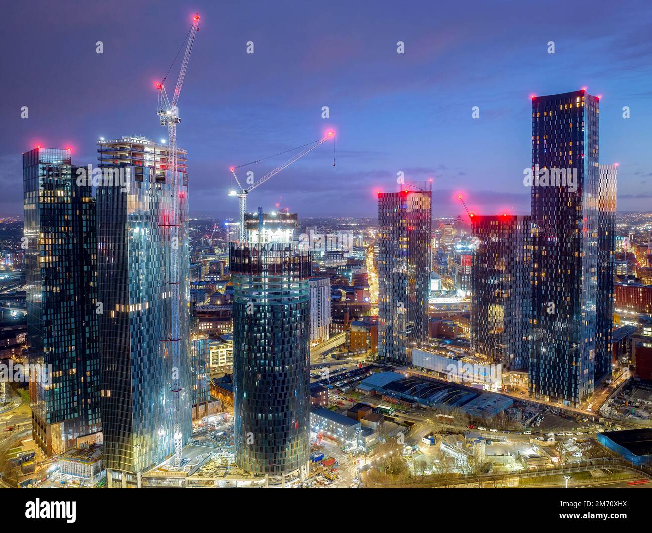 Manchester City centre Aerial night view of Deansgate Square Manchester England, construction building work at dawn with city lights and dark skies Stock Photo