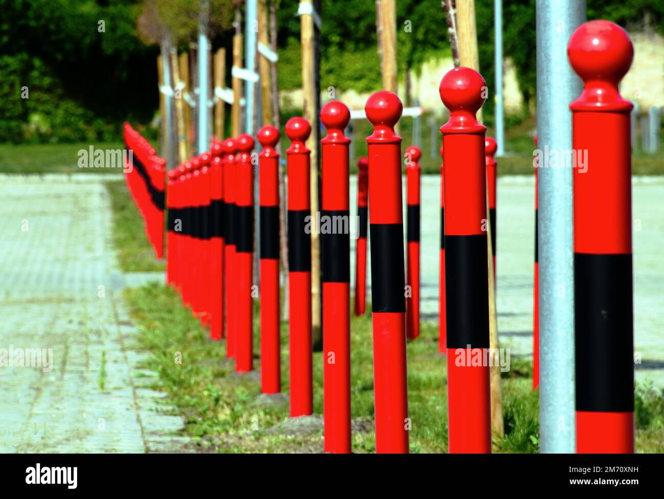 red steel bollards or posts. closeup detail view. sphere shape post ...