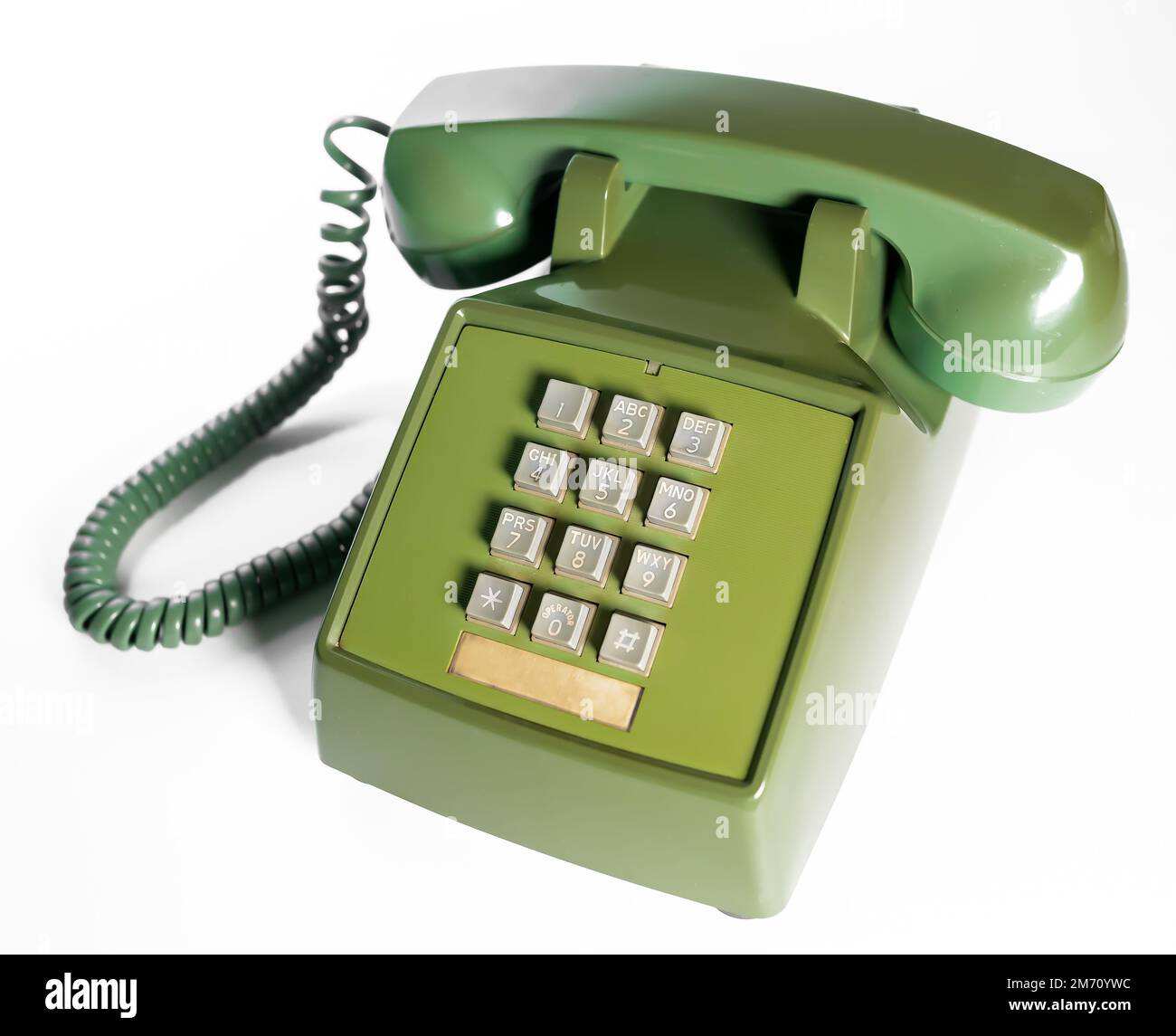Retro push button rotary dial telephone. Vintage avocado green landline  phone Stock Photo - Alamy