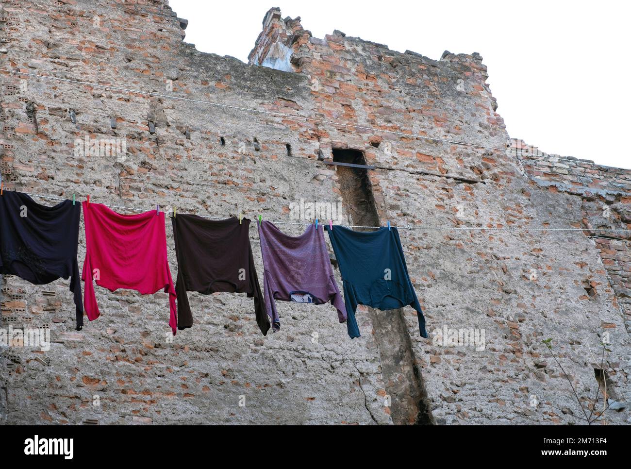 Clothes drying in traditional street and houses at Balat district, Istanbul Stock Photo