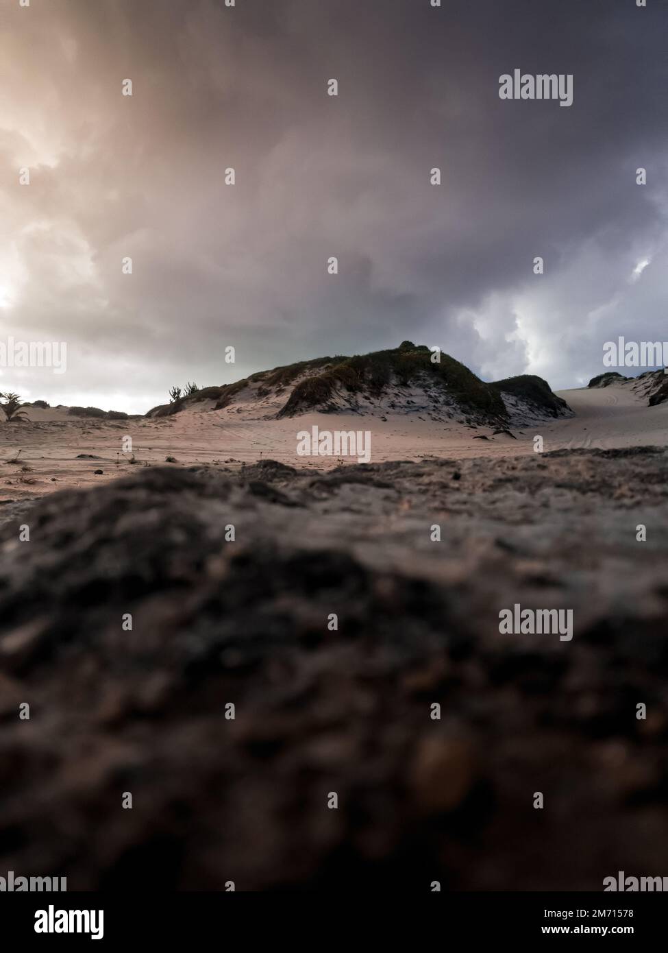 A vertical shot of rocky landscape under stormy sky Stock Photo - Alamy
