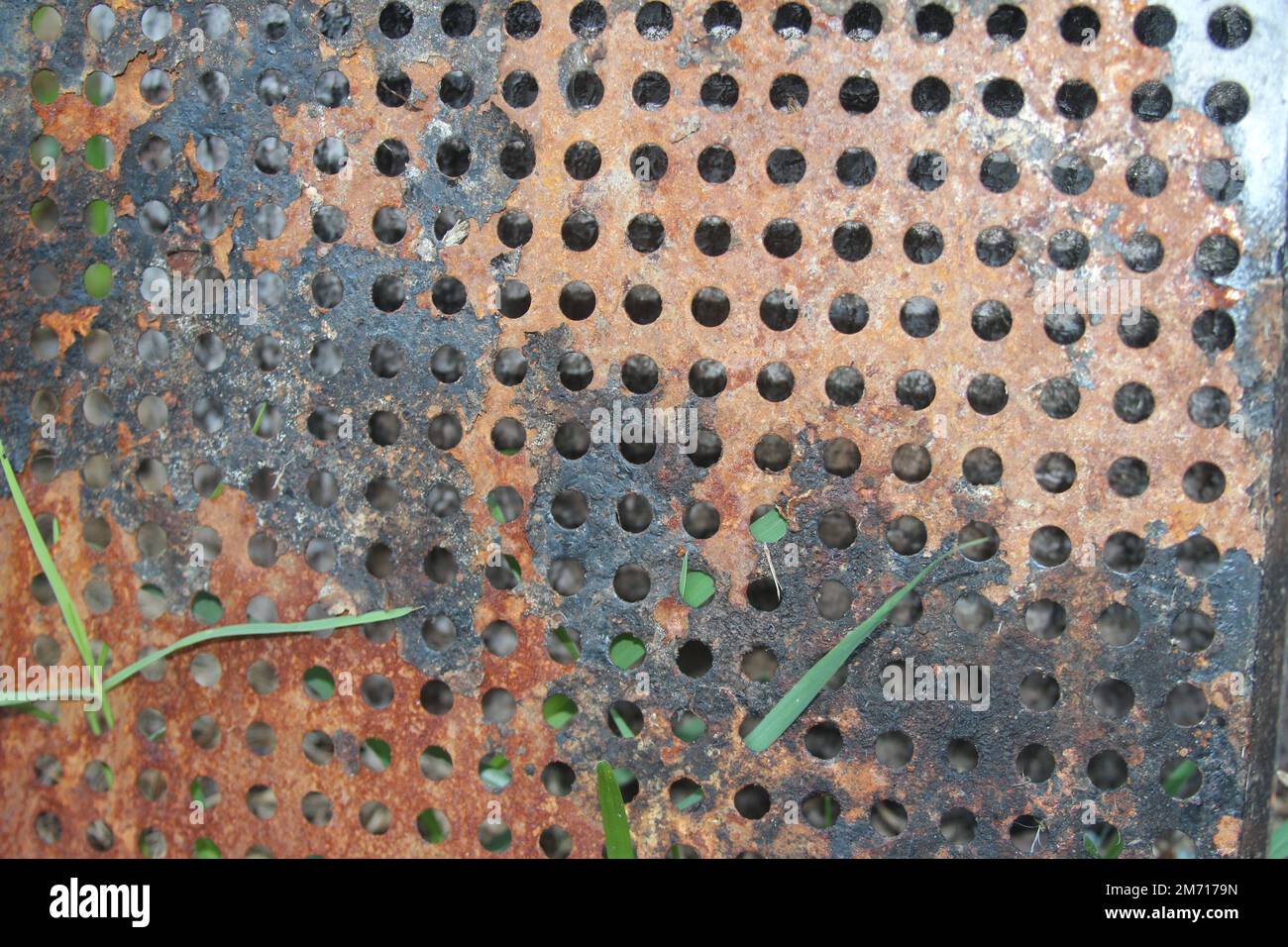 Rusted grill grate with holes texture close up Stock Photo Alamy