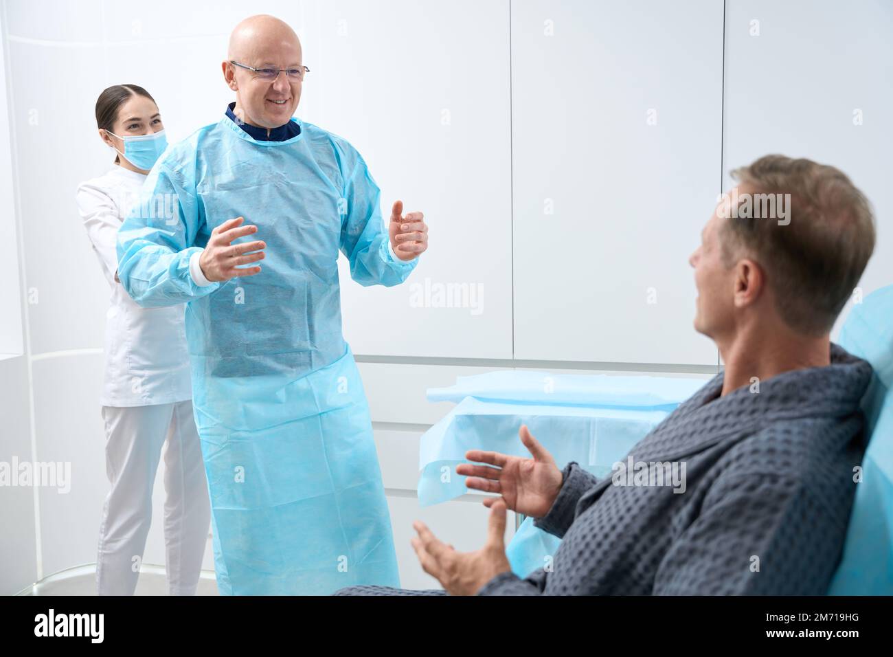 Positive medical staffmembers coming into the room with patient Stock ...